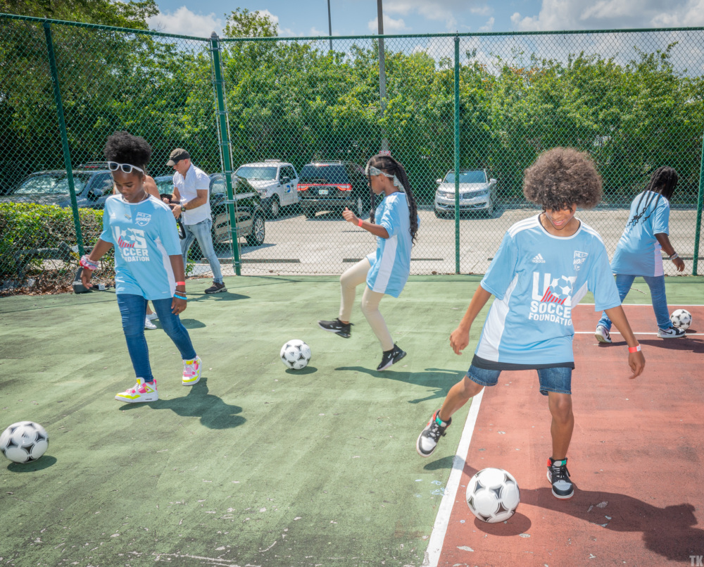 Kids play at the home of a future mini-pitch in Miami